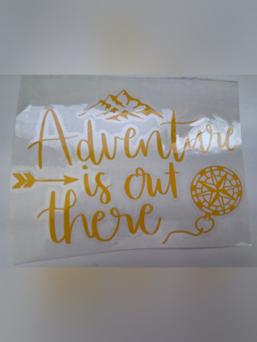 Gold/Yellow "Adventure is Out There" Decal